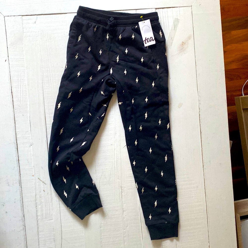Black with white lightening bolt kids joggers age 8. Brand new.